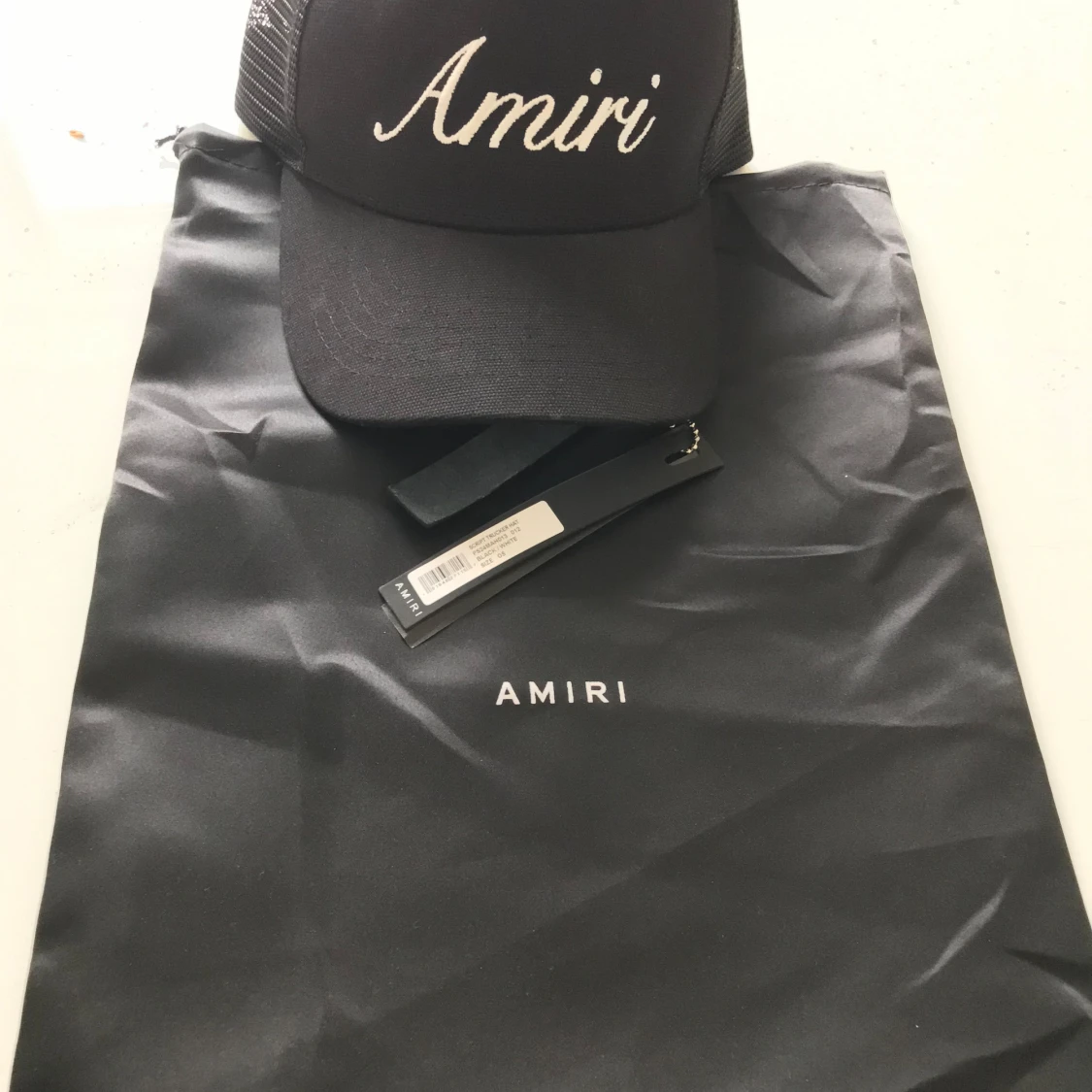 AMIRI Script Trucker Hat