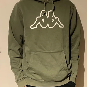 Görn kappa tröja - Grön kappa tröja som är i bra skicka