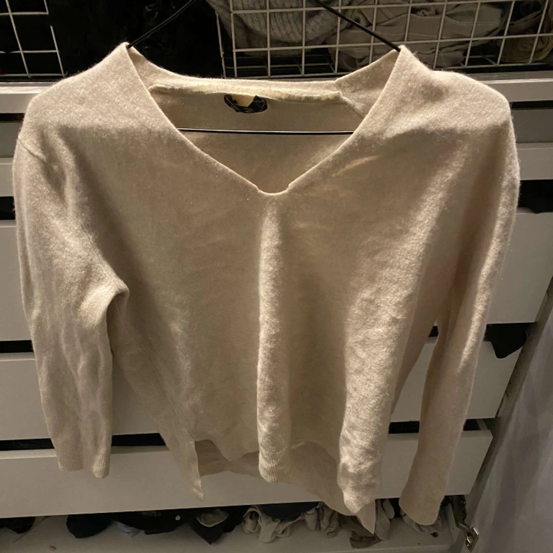 Trekvartsärmad beige stickad tröja