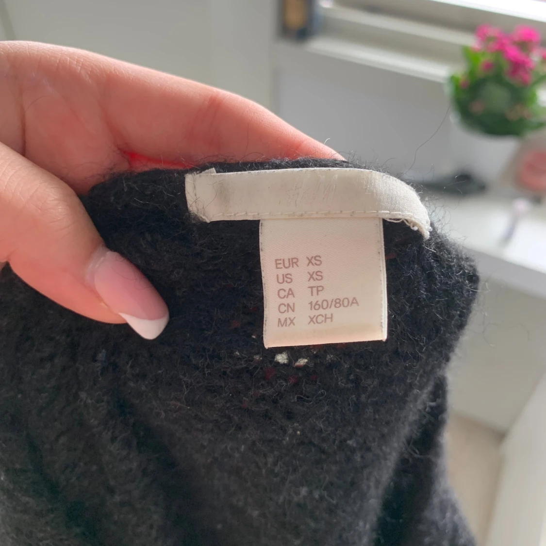 Svart stickad tröja