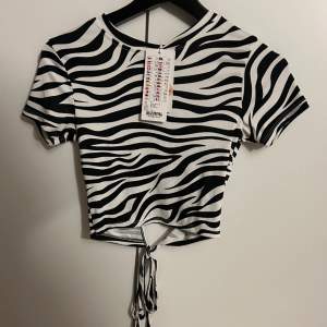 Zebra tröja med öppen rygg