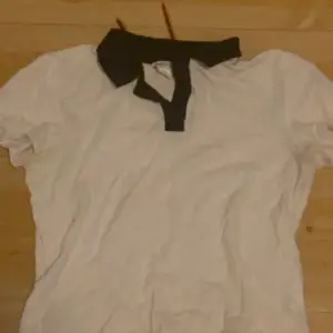 White tshirt with black collar 
