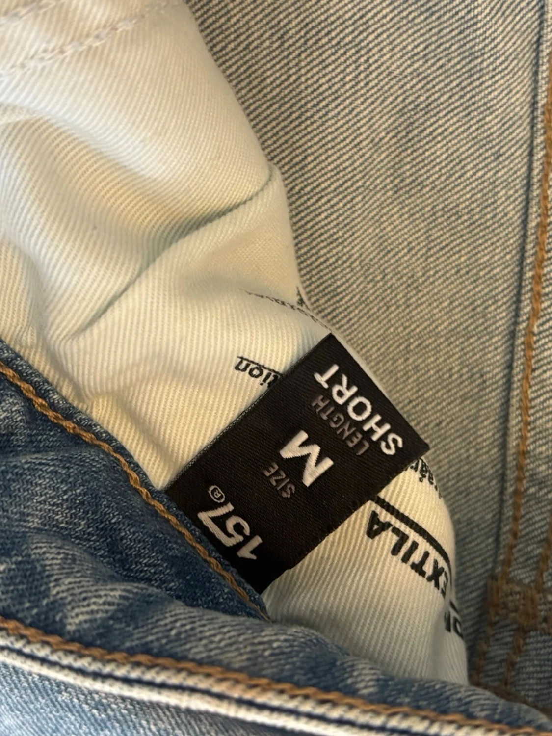 Ljusblå slitna bootcut jeans - 2