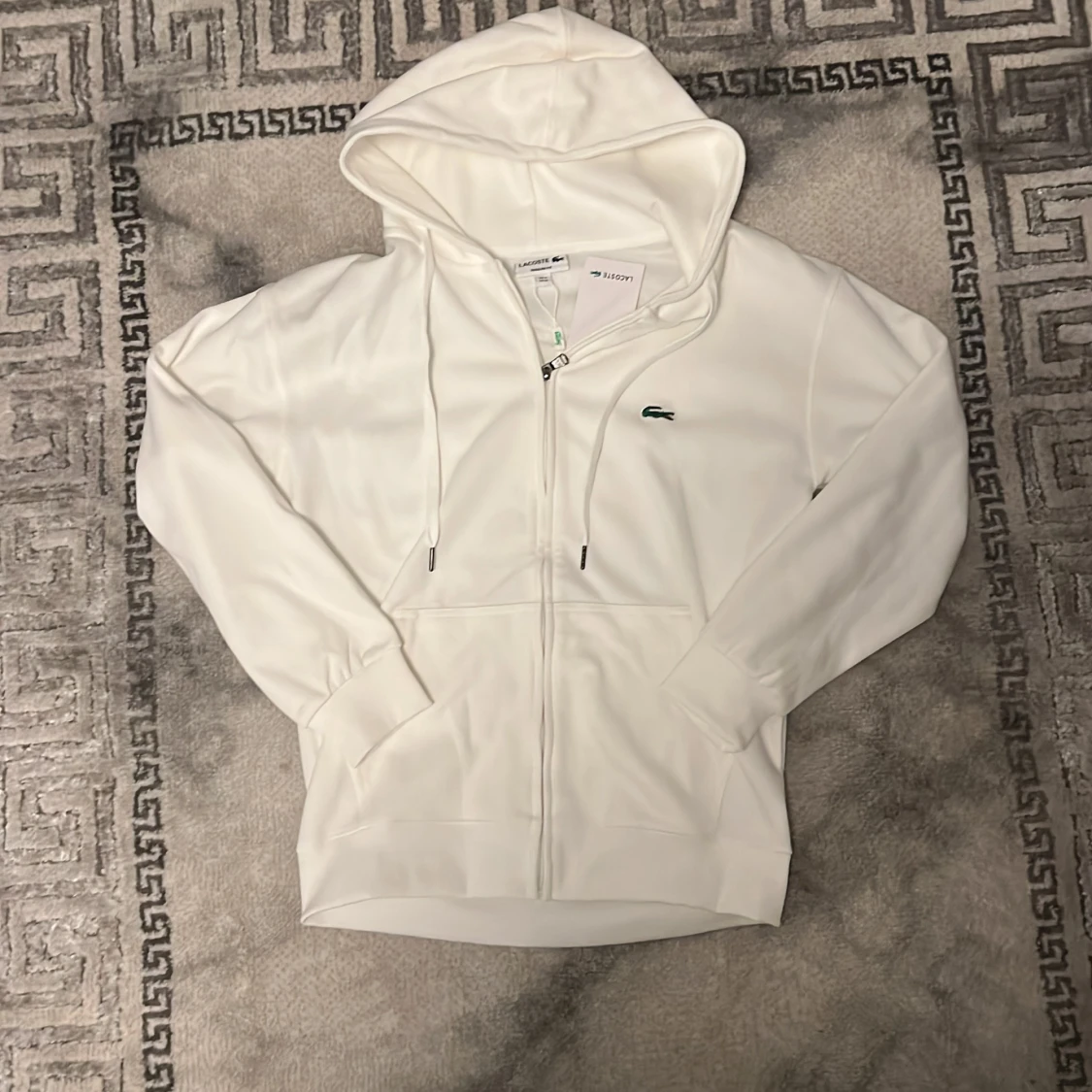 Vit hoodie från Lacoste