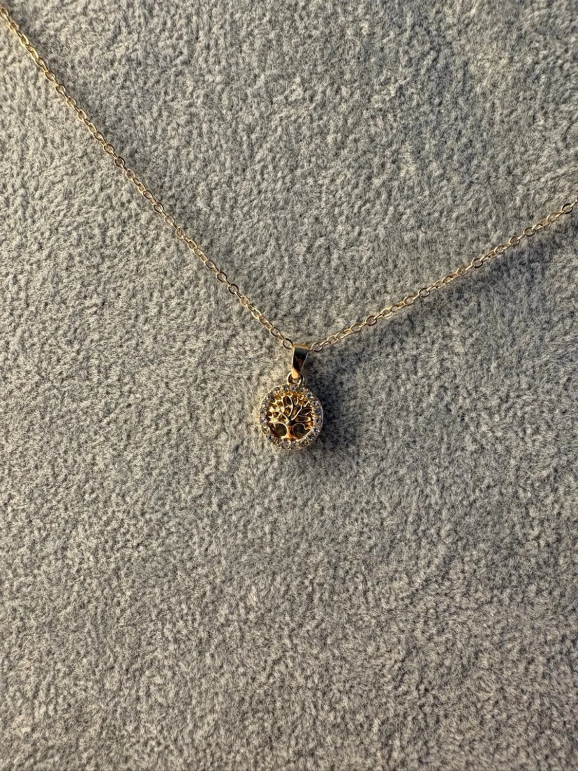 Guld halsband från ur och penn - 1