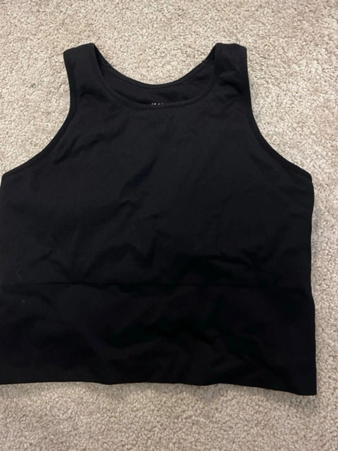 Svart ribbad linnetopp från H&M Sport