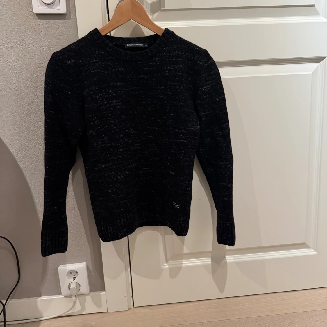 Svart stickad tröja Peak Performance 