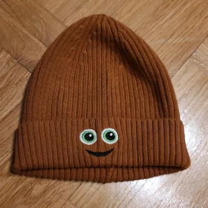 Mössa Babblarna - Brun mössa Babblarna.