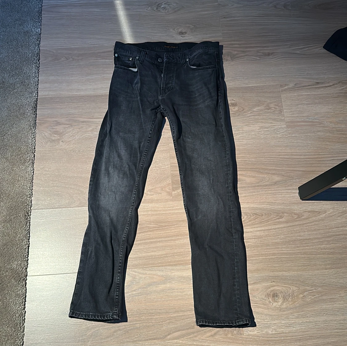 Svarta Nudie Jeans Grim Tim 31/32