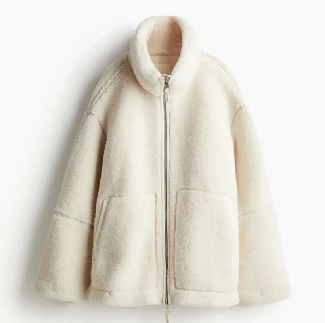 Vit teddyjacka med dragkedja