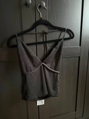 Svart glittertopp  - Ny med prislapp 