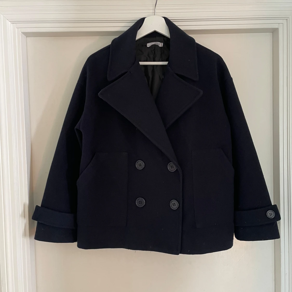 Svart skepparkavaj i polyester XS/S