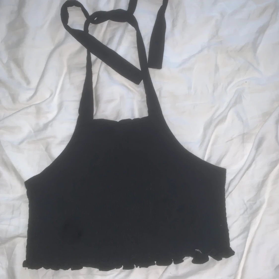 Svart halterneck-topp