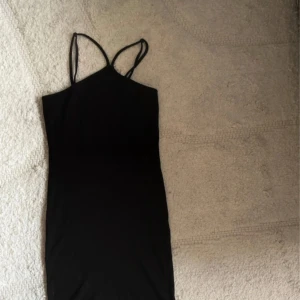 Svart tight klänning  - Aldrig använd