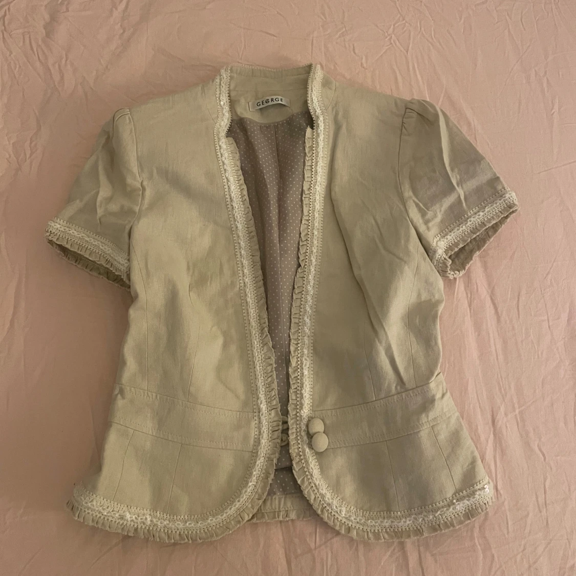 Beige bolero väst