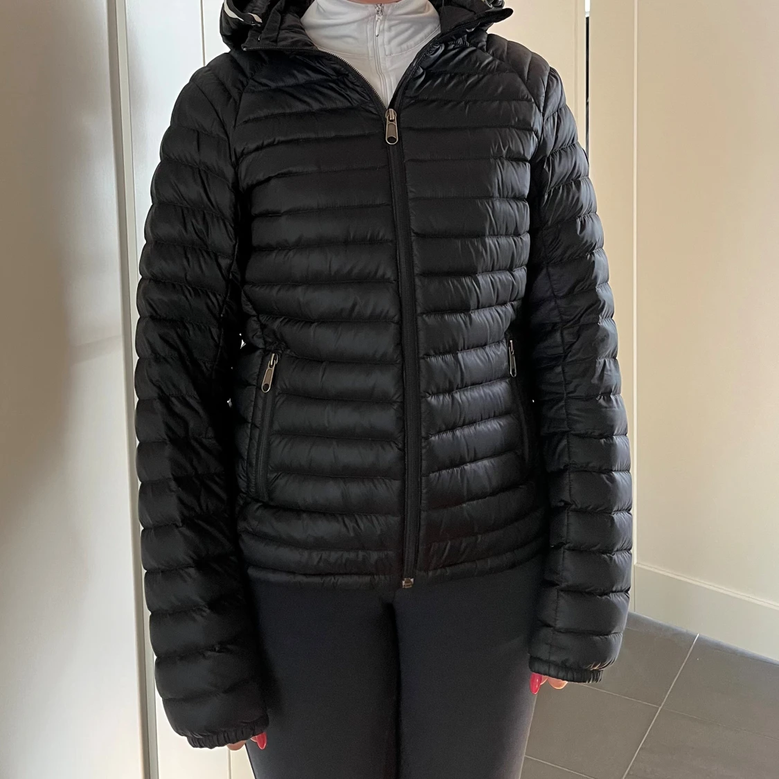 Svart dunjacka Peak Performance