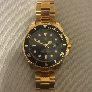 Rolexsubmariner guld/svart  - Priset kan diskuteras vid snabb affär 
