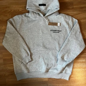Essentials Hoodie - ✨ Essentials Fear of God Hoodie ✨ 👕 Size: M 🎨 Color: Dark Oatmeal 🧵 Material: Soft cotton blend – super comfy & cozy 📌 Condition: New with tags 📦 Perfect for casual wear, streetwear fits, or layering!  🔥 Minimal design with “ESSENTIALS Fear of God” logo on chest 🖤 Kangaroo pocket & ribbed cuffs for comfort🚀 Fast shipping guaranteed ⭐ Great ratings & trusted seller on Vinted ✅ Buy with confidence! like this