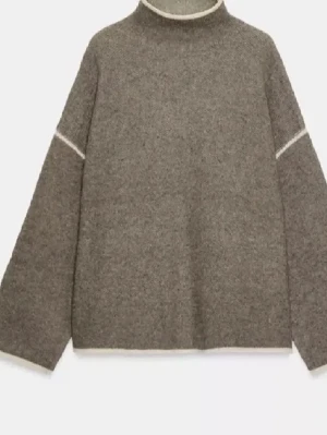 Brun/beige stickad tröja med vita sömmar - Säljer en brun stickad tröja med ljusa kanter och vida  ärmar. Supersnygg och eftertraktad, slutsåld på hemsidan☺️