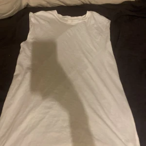 Badklänning - En badklänning som är perfekt att dra på sig över badkläderna, sällan anvönd