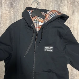 Burberry zip up  - I did not like how big the hood was 