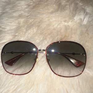 Gucci GG0228-001. Red and Gold. With box and in good condition. Will take offers