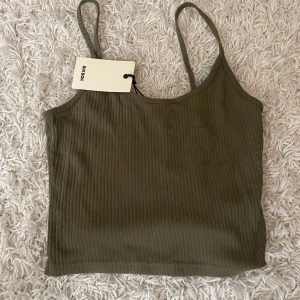 Topp - En grön topp. Oanvänd. 