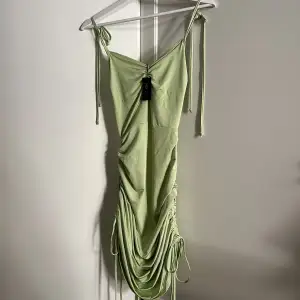 Light green silky dress from Nelly.com. Never used with labels still attached.