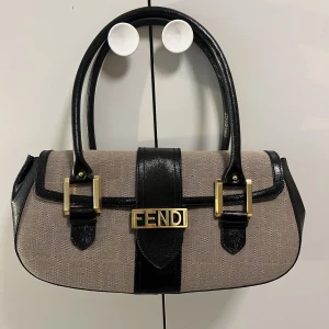 Fendi bag - Fendi vintage baguette bag, bought in 2005 by my mom in Rome! Used twice, it doesn’t have a scratch. As new, it still has the label!! Impossible to find, really rare vintage. 