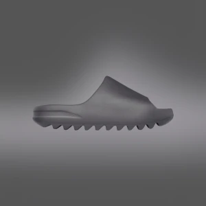 Yezzy slide granite - Helt nya slides van dom från Adidas appen,  Storlek 43  Dom är grå svarta 