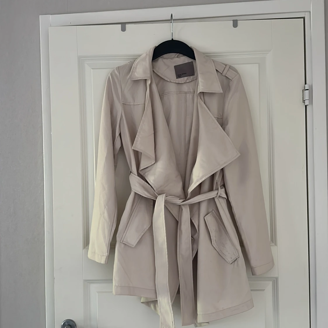 Beige trenchcoat