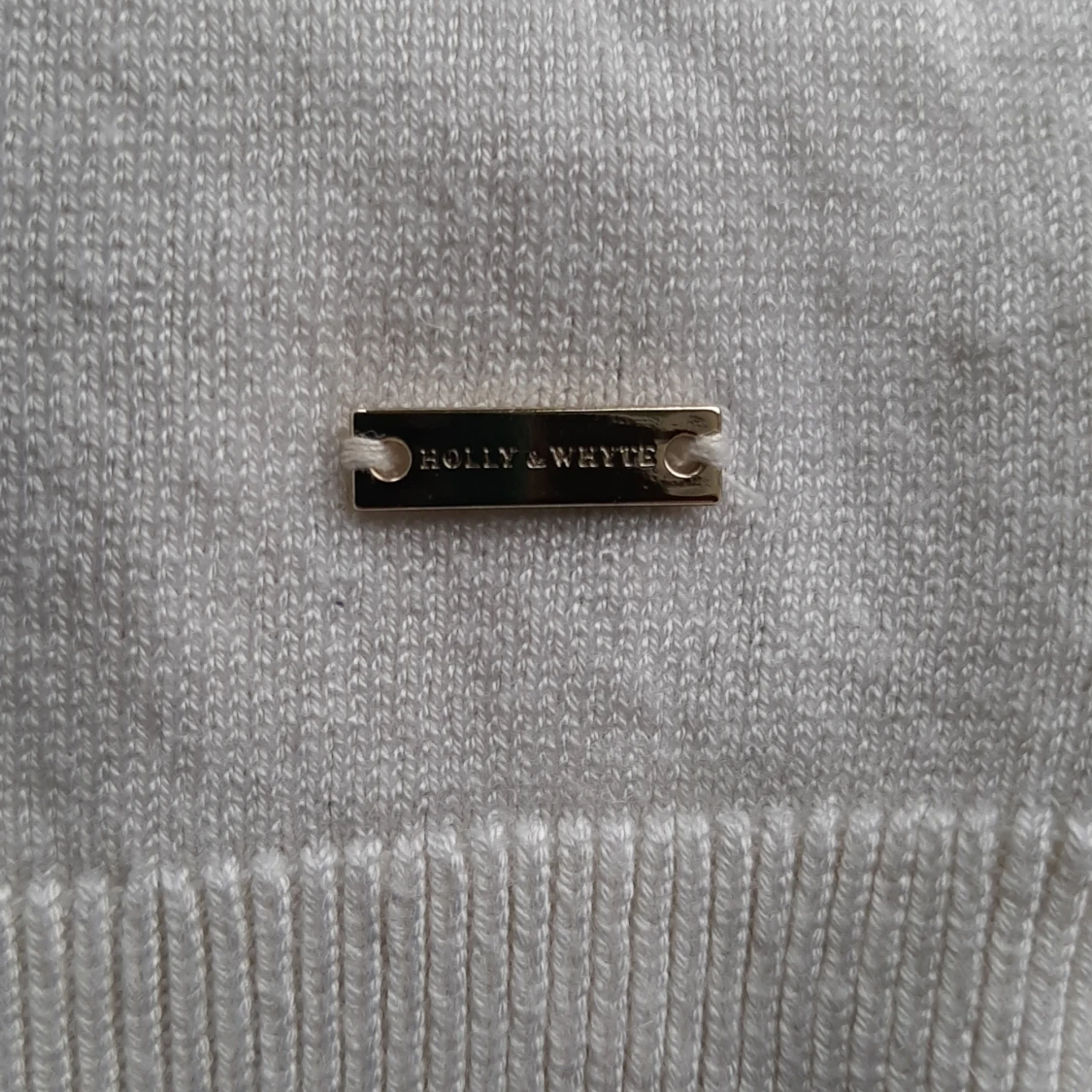 Somrig väst i en off white färg  - 91