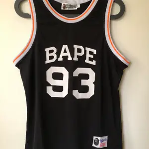 Bape / A Bathing Ape ‘93 Retro Tank Top Jersey  Size medium, fits like a regular men’s size medium.  Excellent condition, no flaws or damage.  DM if you need exact size measurements.   Buyer pays for all shipping costs. All items sent with tracking number.   No swaps, no trades, no offers. 