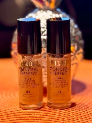 Milani Conceal + Perfect 05 Warm Beige - Två flaskor sälj tillsammans. Milani Conceal + Perfect 2-in-1 Foundation & Concealer i nyansen 05 Warm Beige. Flytande foundation och concealer i ett, ger medium till full täckning och är vattenfast. En flaska är ny och oöppnad och den andra innehåller ca 70%.