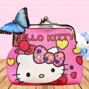 Söt portmonä med Hello Kitty-motiv! - Söt portmonä med Hello Kitty-motiv. Mått: 12 x 8 cm. Oanvänd.