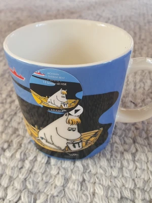 Ny Muminmugg HSR Vår kust Mumin  - Utgången felfri mugg med etikett kvar. Packar mycket bra. 