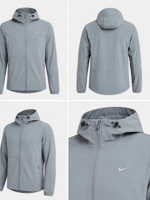 Ljusgrå vindjacka från Nike - Stilren ljusgrå vindjacka från Nike med dragkedja framtill, justerbar huva och två sidofickor. Jackan har minimalistisk design med Nike-logga på bröstet och elastiska muddar vid ärmsluten. Perfekt för blåsiga dagar.