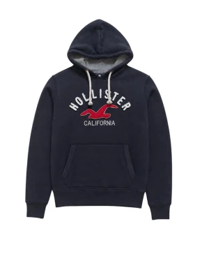 Mörkblå Hollister hoodie med tryck - As fet Mörkblå hoodie från Hollister med vit broderad text och röd logga på bröstet. Klassisk känguruficka framtill, vit dragsko i huvan och mjukt innerfoder. Perfekt för en avslappnad och stilren look.