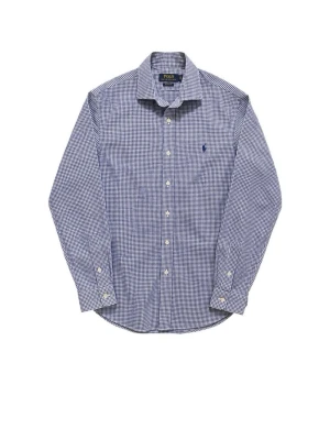 Blårutig skjorta från Polo Ralph Lauren - Klassisk blårutig skjorta från Polo Ralph Lauren med lång ärm och knappar framtill. Skjortan har en broderad logga på bröstet och är tillverkad i mjuk bomull. Perfekt för en clean och stilren look.
