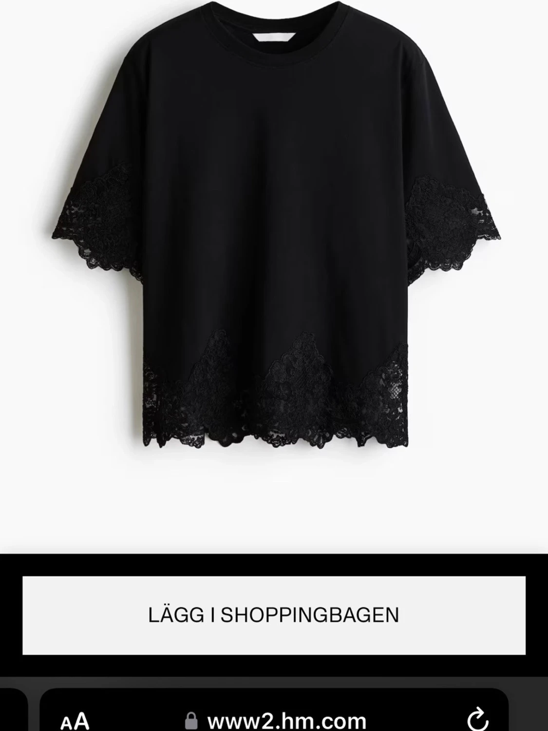 Svart topp med spetsdetaljer