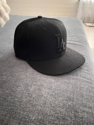 New era cap - Svart New era keps storlek 57,7cm
