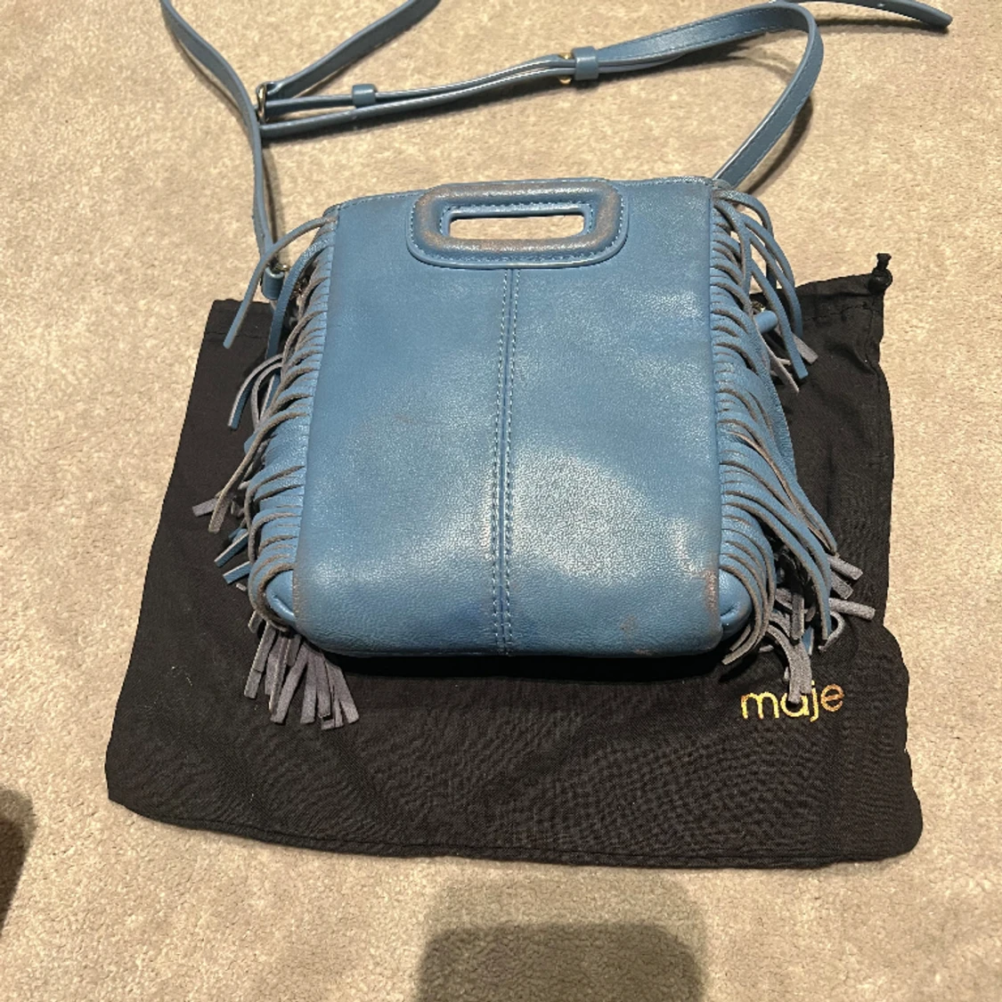 Ljusblå maje väska