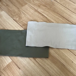 Två tube tops från gina tricot - Båda kostar 100kr tillsammans. En grön och en beige i storlek XL