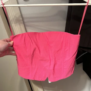 Rosa korsett topp  - Oanvänd korsett topp ifrån Nelly, oanvänd 🫶