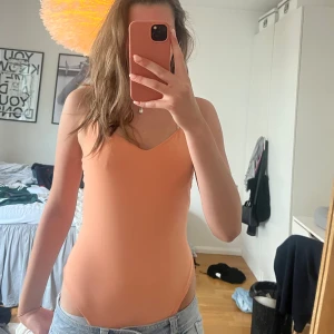 Aprikos body Hm - Aldrig använd och i jätteskönt material
