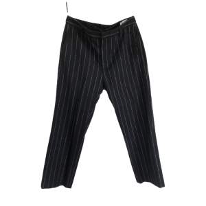 Pinstripe pants from Swedish brand HOPE.  These are unisex. I wear size 26 in jeans and these fit me a little bit loose.  They are mid rise and are slightly cropped at ankle.  Very well made and in mint condition :)  Made of:  55% Wool 30% Polyester 