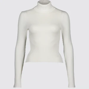 Vit polotröja  - Vit långärmad polotröja. Den är ribbad och den är helt oanvänd.