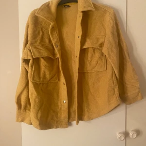 Kort jacka  - Lång ner till höfterna 