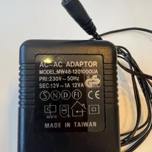 AC-AC adaptor  Model: MW48-1201000UA