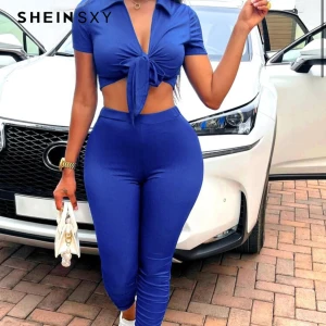 Blått set från SHEIN - Snyggt blått set från SHEIN. Byxorna sitter riktigt fint på kroppen och tröjan kan man anpassa med knuten. Aldrig använt!😁🌸